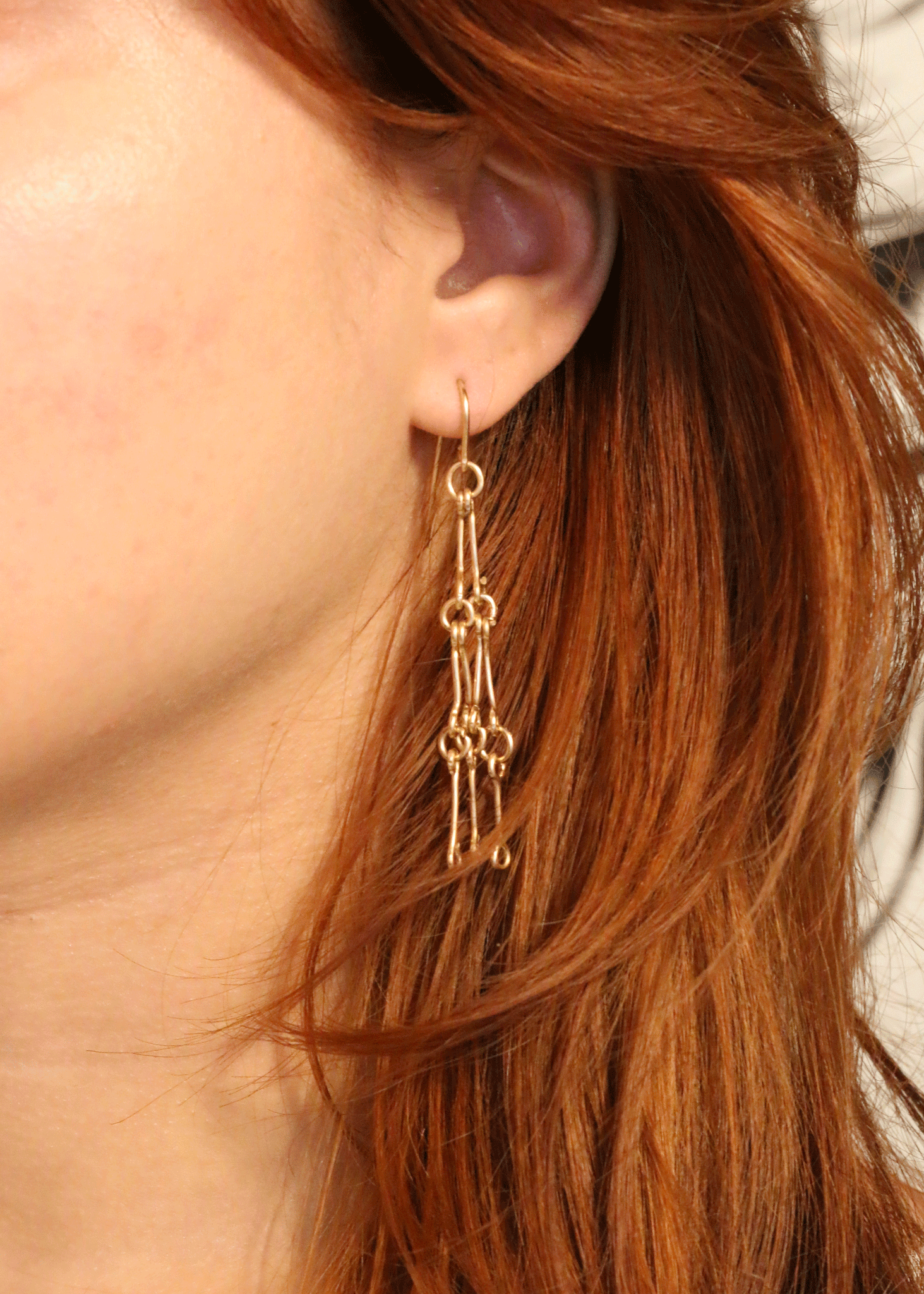 brass dangle interlock earrings
