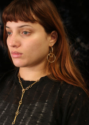 brass dangle orbit earrings